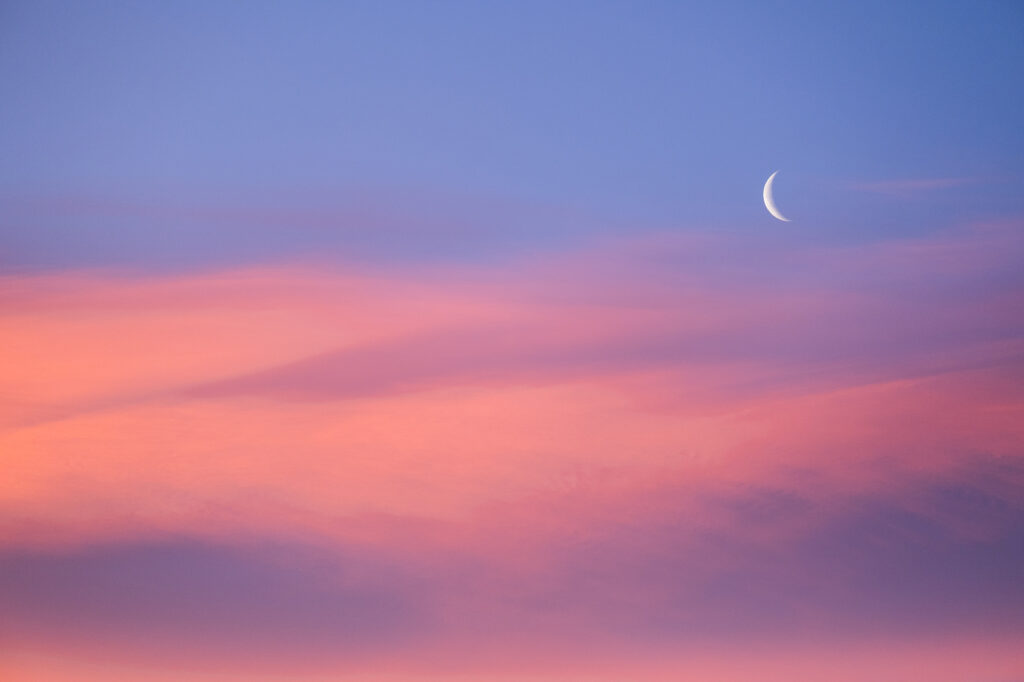Crescent moon during beautiful pink sunrise AdobeStock 1019015976 1024x682